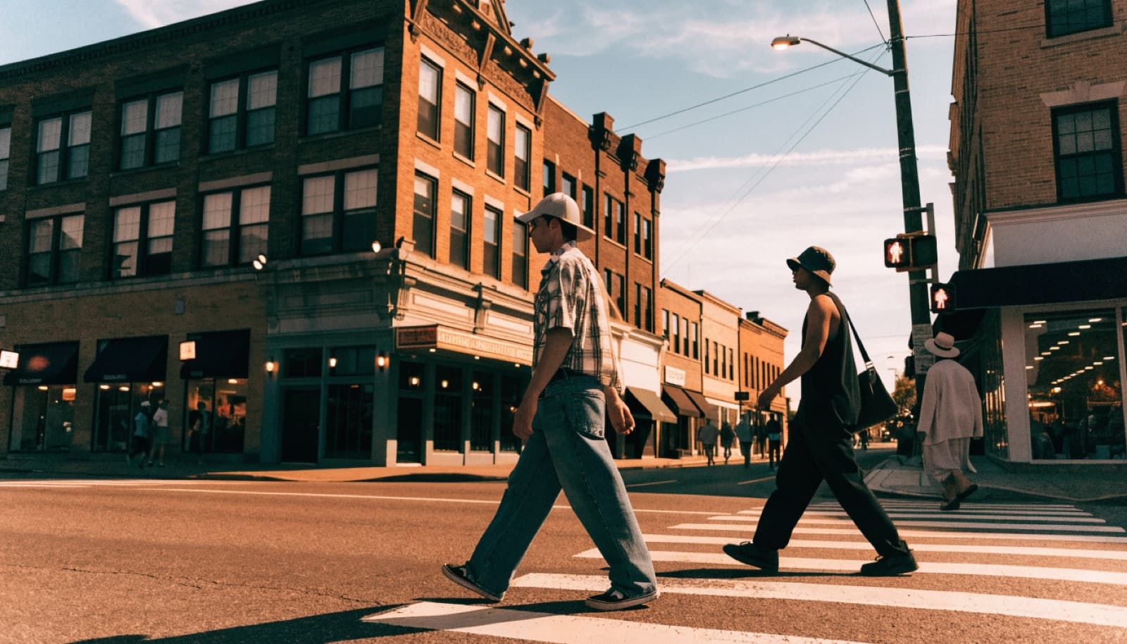 Illustration: locals crossing a downtown main street
